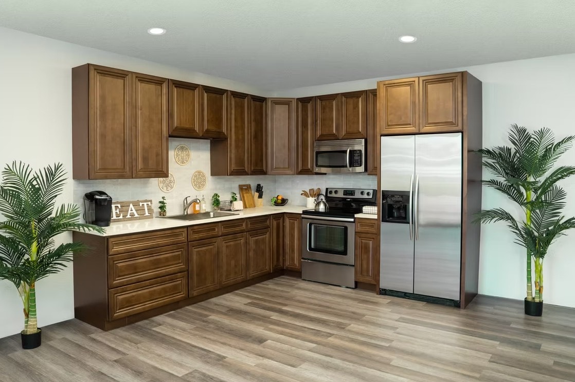 Full view of Dark Caramel kitchen with refrigerator and stainless steel appliances