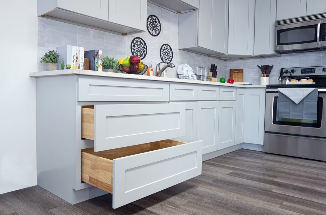 Dove Grey cabinets with open drawers showing dovetail wood construction