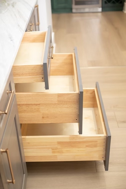 Driftwood cabinet interior showing dovetail wood drawers