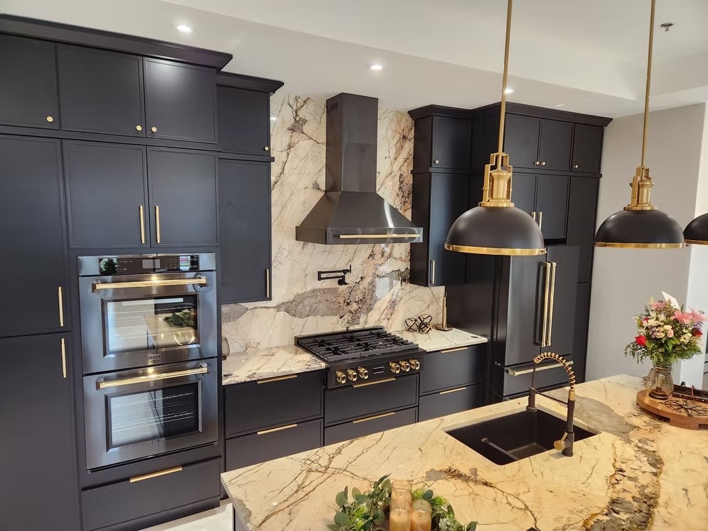 Slim Shaker Ebony kitchen with double oven, gas range and marble backsplash